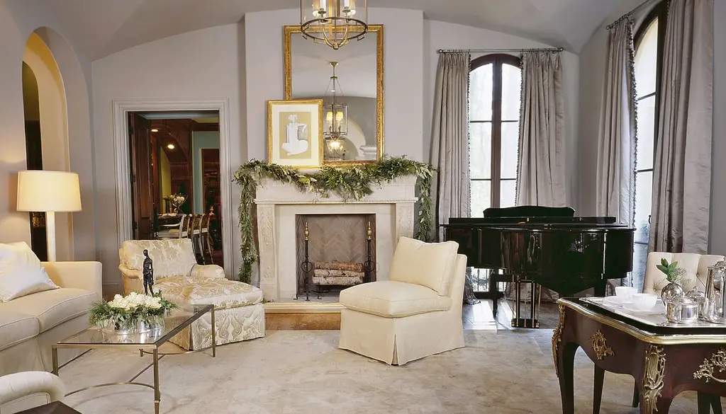 A living room with a multi-speaker home theater layout and an AV receiver
