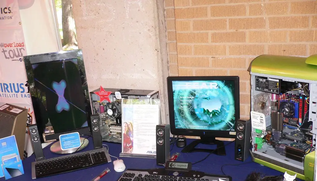 A high-refresh-rate gaming monitor on a desk showing a fast-paced game