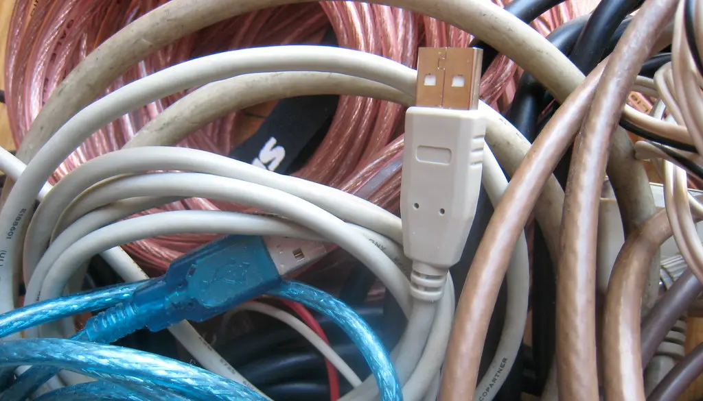 An Ethernet cable plugged into the back of a home router