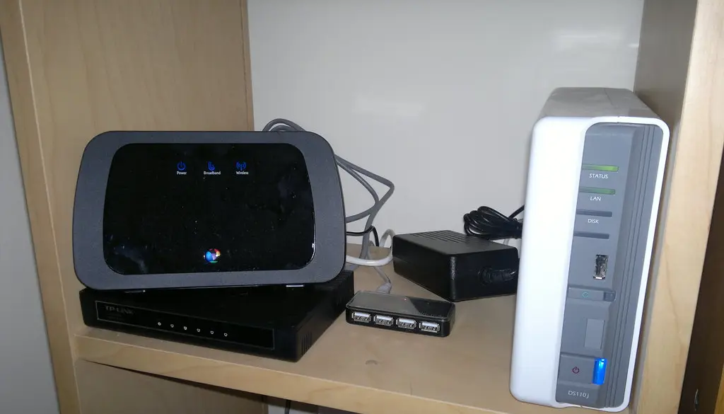 A home router with several Ethernet cables plugged into the back
