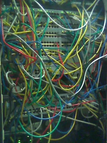 A network rack with switches and status lights in a server closet