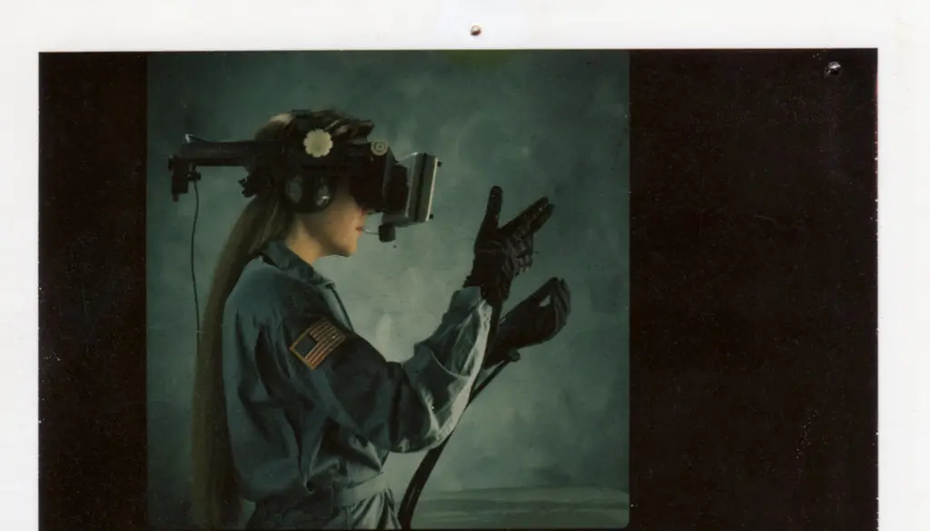 A virtual reality headset resting beside its controllers